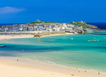 The beach and bright blue waters of St Ives