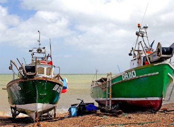 Boats moored up at Deal on the beach