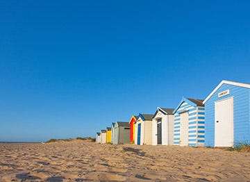 The iconic and colourful beach huts of Suffolk